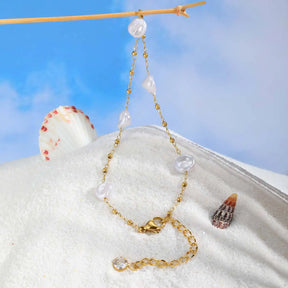 Tornozeleira Dourada com Pedras Barrocas – Charme Natural e Sofisticação Leve